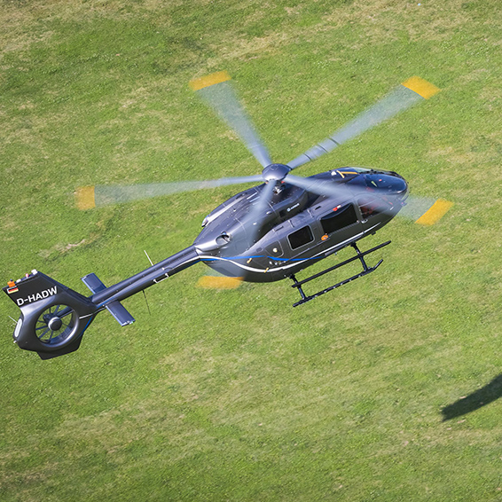 H145 helicopter flying over the Pyrenees